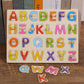 Wooden alphabet peg puzzle board